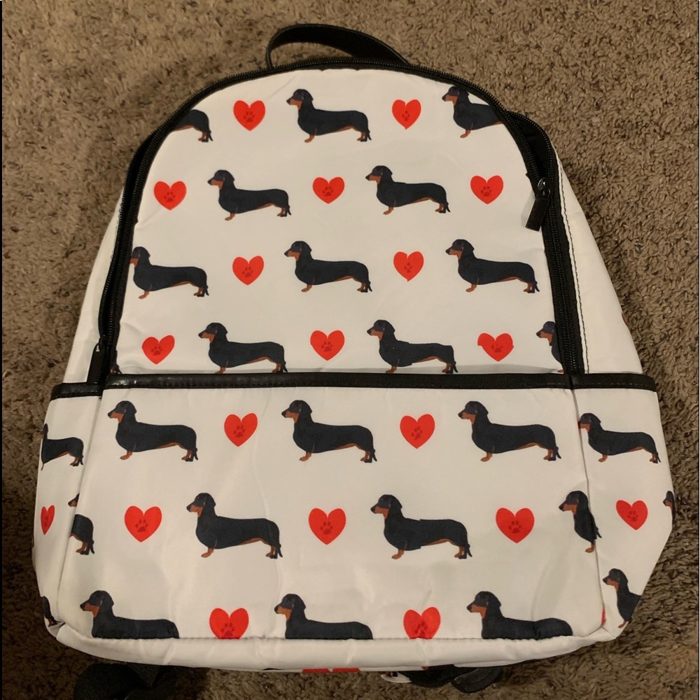 White with red hearts black and brown dachshund backpack